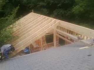 Framing a new roof addition that ties into an existing shingle roof in Twain Harte